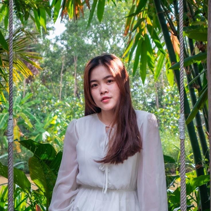 Kaveri Mehta, Lead Design Curator at SpringsPassageMaple, reviewing corporate floral arrangements